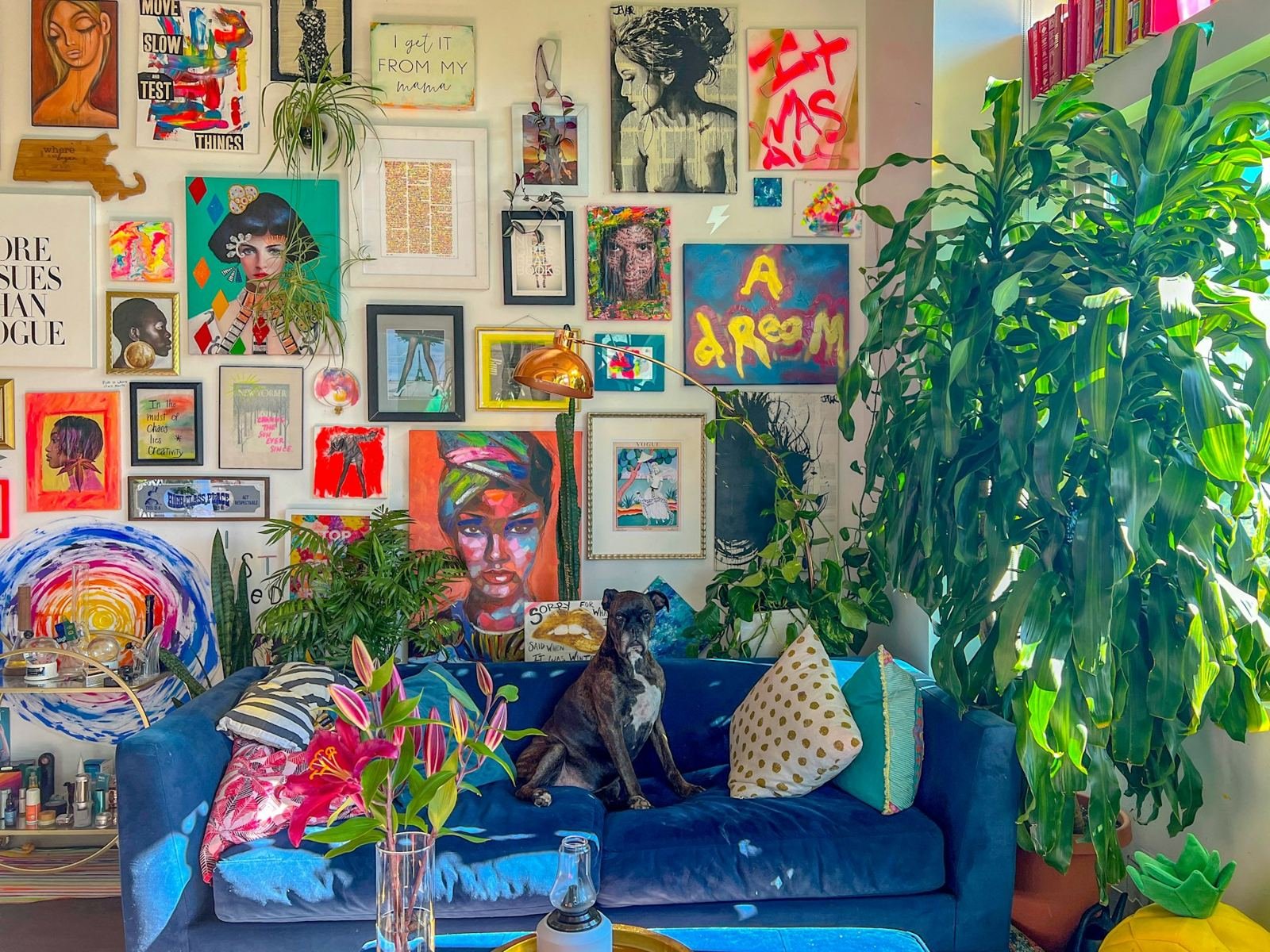 A colorful living room with a gallery wall
