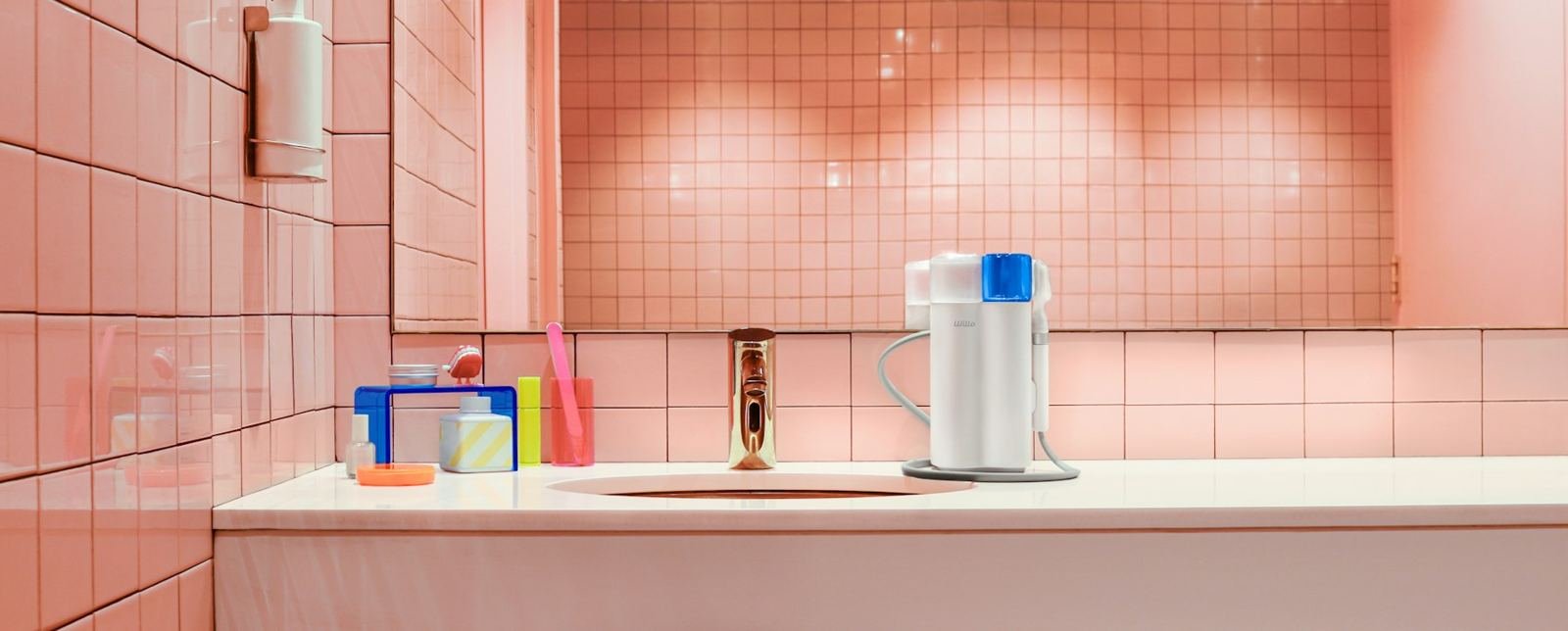 A blush-pink tiled bathroom